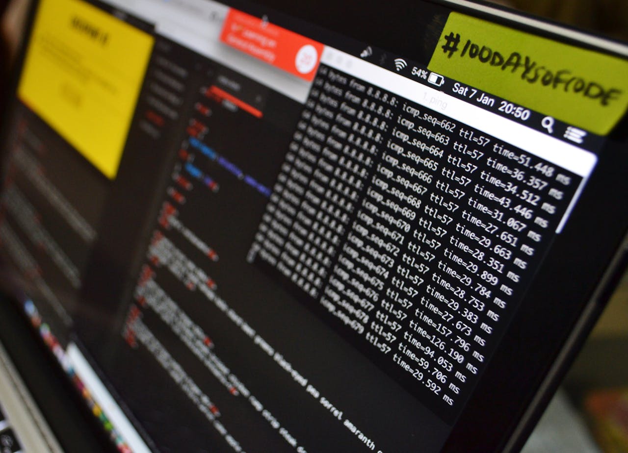 Macro shot of a laptop displaying coding and data analysis in progress. Ideal for tech themes.